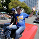 Golden State Warriors owner Joe Lacob and fiancee Nicole Curran wave to fans during the NBA championship parade in Oakland, Calif., on Thursday. (Anda Chu/Bay Area News Group)